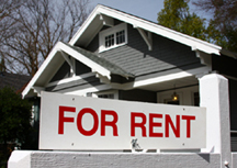 house with a for rent sign in front