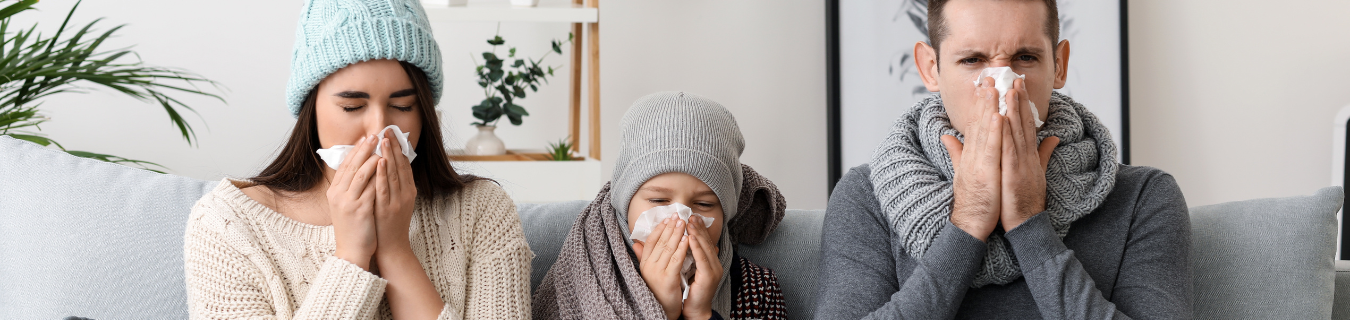 Family blowing their noses