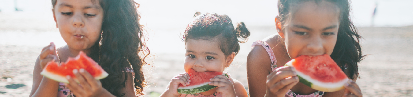 Kids eating watermelon