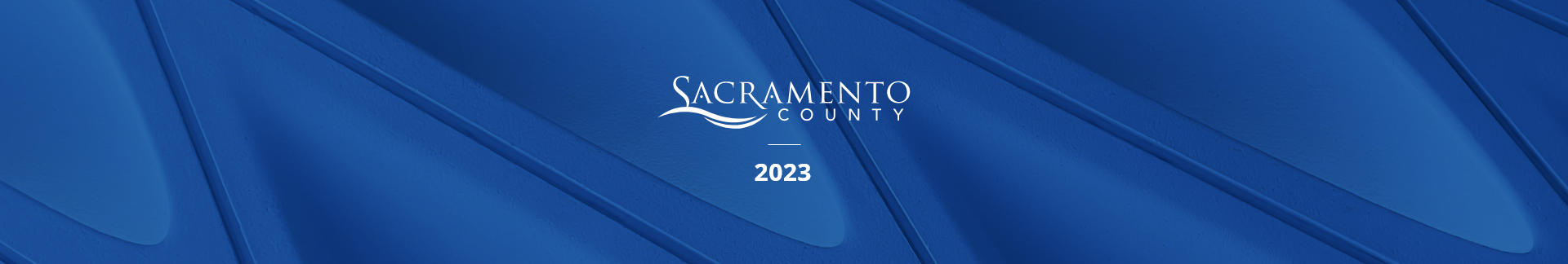 County logo and the year 2023 on a textured, blue background 