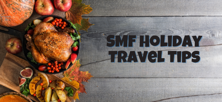 Thanksgiving feast on a wooden table - SMF Holiday Travel Tips