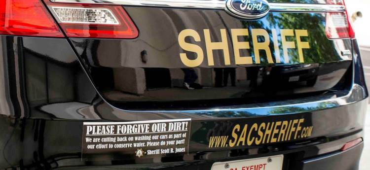 Water Conservation Bumper Sticker on Sheriff Vehicle