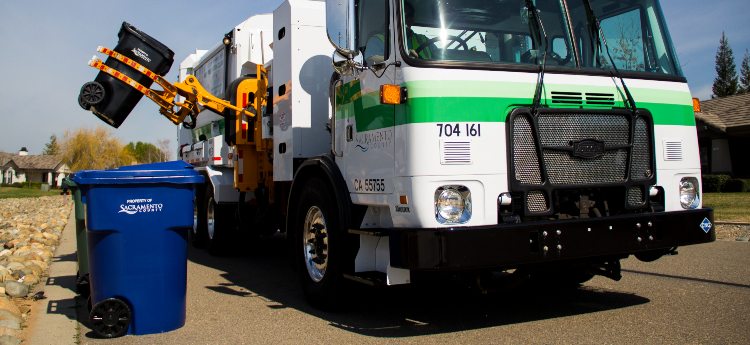 Sacramento County Waste Management Truck Picking Up Garbage Cart