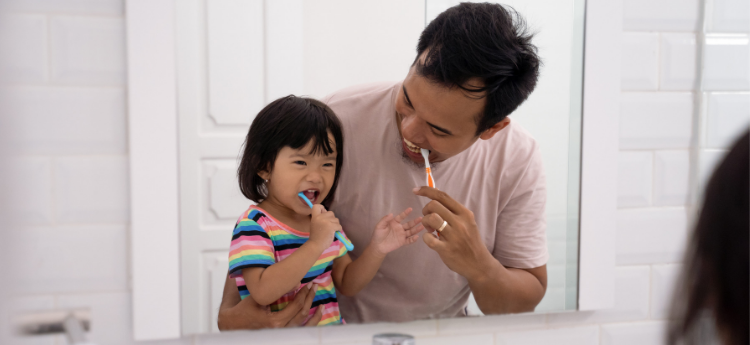 Dad and Kid Brushing Teeth