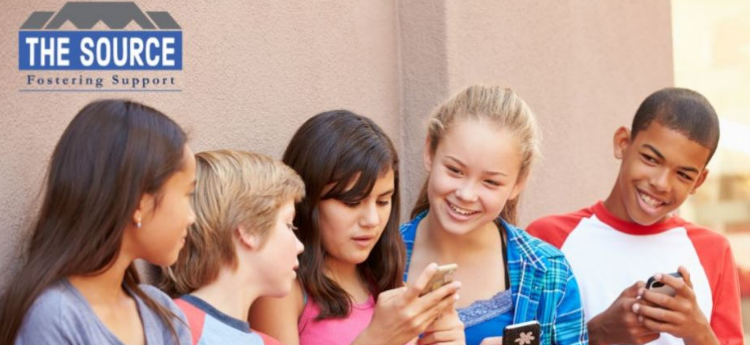 Group of ethnically diverse children on their cellphones with the Source Fostering Support Logo in the upper left-hand corner. 
