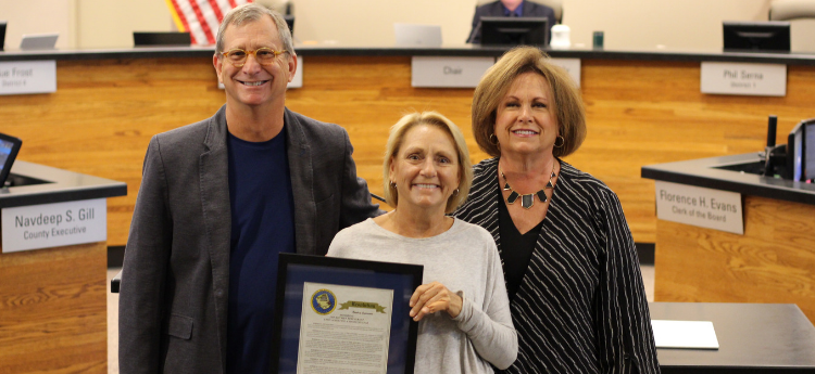 Supervisor Susan Peters Presents Board Resolution to the owners of The Kitchen Restaurant. 