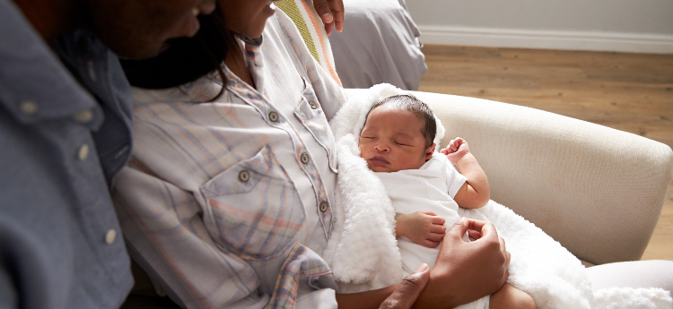 African American Parents and their newborn baby