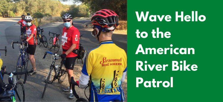 Wave Hello to the American River Bike Patrol - Photo of Bike Patrol Members speaking with bicyclists 