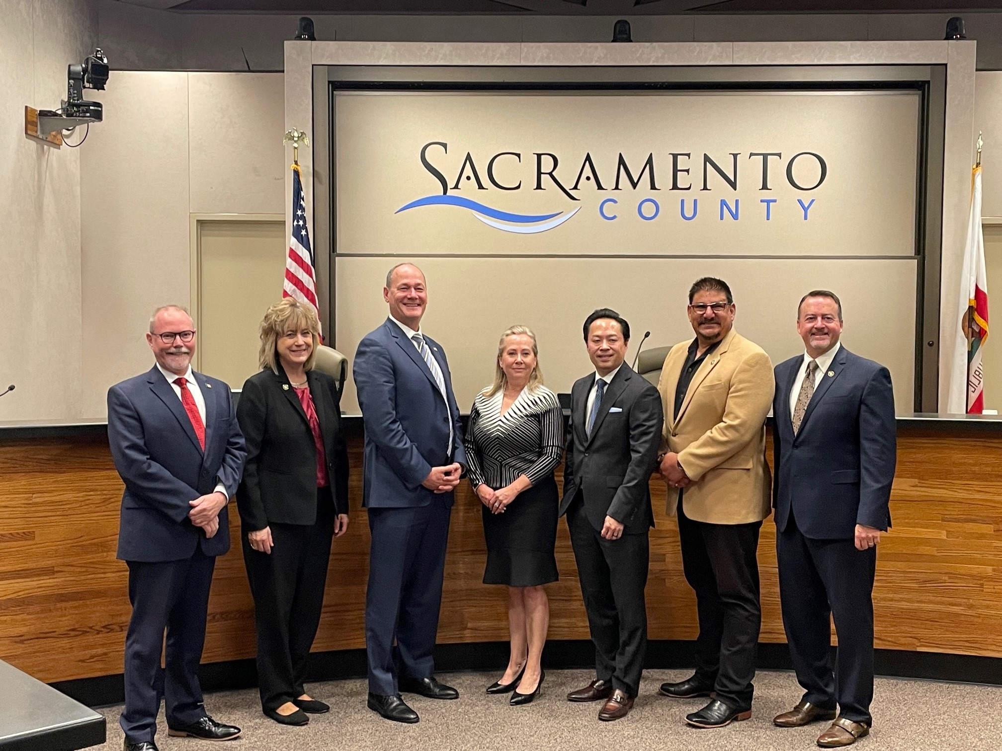 Members of the Sacramento County Board of Supervisors pose for a photo with Asessor, Christina  Wynn and DA Thien  Ho