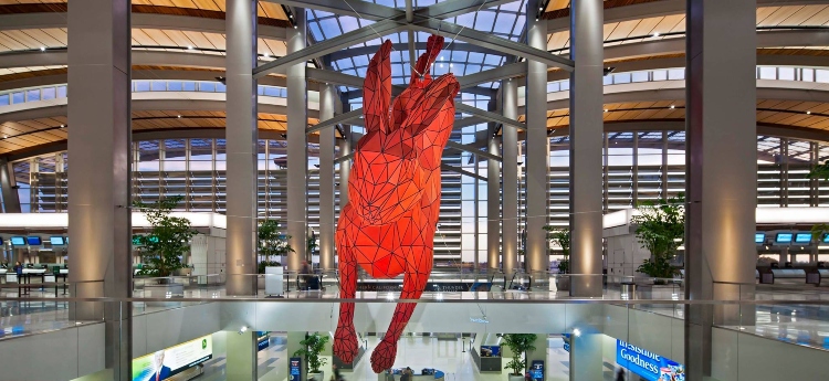 Photo of the red leaping rabbit art piece located inside SMF