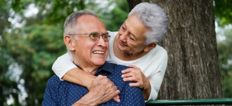 Elderly couple hugging 